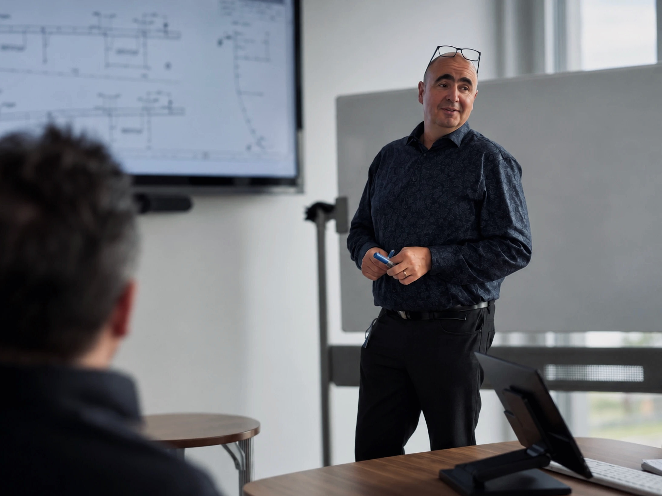 Warnow Design engineer explaining a ship drawing on screen